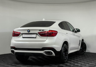 Подержанный автомобиль BMW X6 2018 года (2 фото)