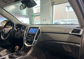 Подержанный автомобиль Cadillac SRX 2013 года (10 фото)