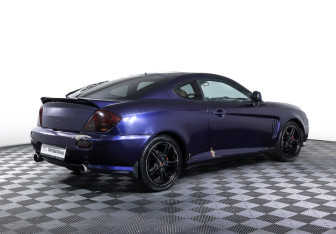 Подержанный автомобиль Hyundai Coupe 2002 года (5 фото)