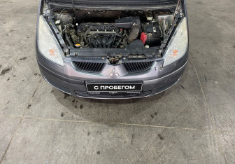 Подержанный автомобиль Mitsubishi Colt Hatchback 2006 года (14 фото)