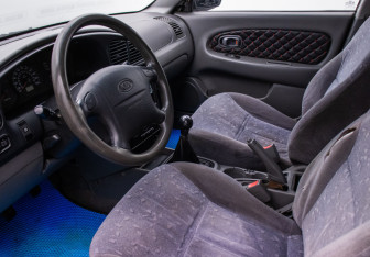 Подержанный автомобиль Kia Spectra Sedan 2006 года (10 фото)