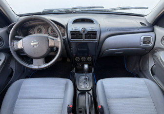 Подержанный автомобиль Nissan Almera Classic 2012 года (12 фото)