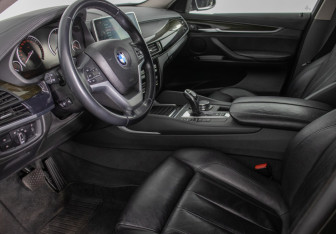 Подержанный автомобиль BMW X6 2015 года (10 фото)