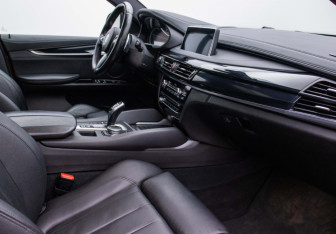 Подержанный автомобиль BMW X6 2015 года (10 фото)