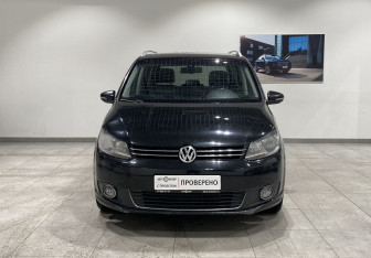 Подержанный автомобиль Volkswagen Touran 2013 года (2 фото)