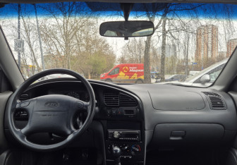 Подержанный автомобиль Kia Spectra Sedan 2006 года (9 фото)