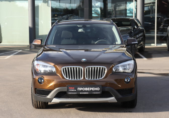 Подержанный автомобиль BMW X1 2013 года (2 фото)