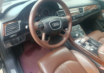 Подержанный автомобиль Audi A8 2014 года (13 фото)