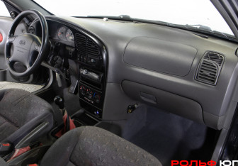 Подержанный автомобиль Kia Spectra Sedan 2006 года (7 фото)