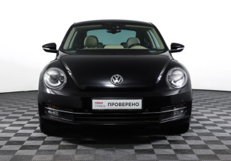 Подержанный автомобиль Volkswagen Beetle Hatchback 2014 года (2 фото)