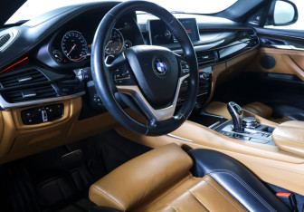 Подержанный автомобиль BMW X6 2014 года (13 фото)