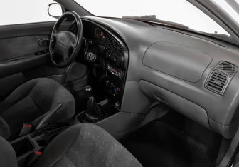 Подержанный автомобиль Kia Spectra Sedan 2006 года (9 фото)