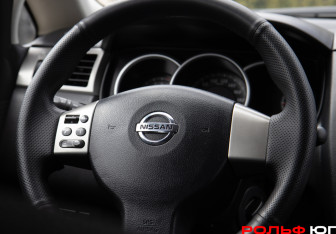 Подержанный автомобиль Nissan Tiida Sedan 2011 года (14 фото)