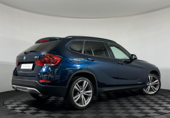 Подержанный автомобиль BMW X1 2014 года (2 фото)