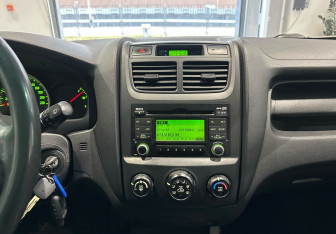 Подержанный автомобиль Kia Sportage 2009 года (17 фото)
