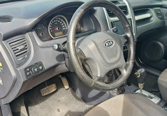 Подержанный автомобиль Kia Sportage 2010 года (13 фото)