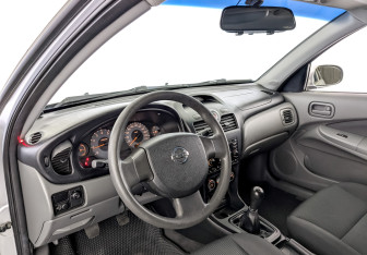Подержанный автомобиль Nissan Almera Classic 2009 года (16 фото)