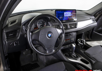 Подержанный автомобиль BMW X1 2013 года (18 фото)