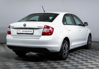 Подержанный автомобиль Skoda Rapid Liftback 2014 года (5 фото)