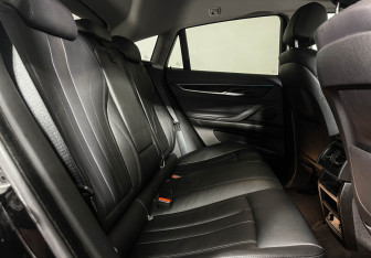 Подержанный автомобиль BMW X6 2016 года (14 фото)