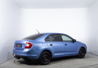 Подержанный автомобиль Skoda Rapid Liftback 2014 года (5 фото)