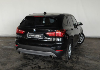 Подержанный автомобиль BMW X1 2015 года (7 фото)