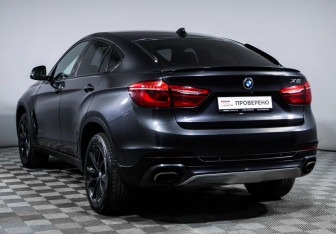 Подержанный автомобиль BMW X6 2016 года (7 фото)