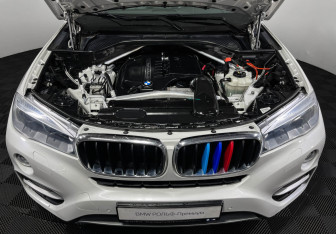 Подержанный автомобиль BMW X6 2016 года (10 фото)