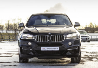Подержанный автомобиль BMW X6 2015 года (2 фото)