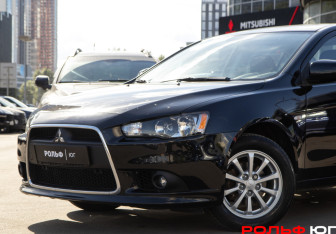 Подержанный автомобиль Mitsubishi Lancer Sedan 2014 года (13 фото)
