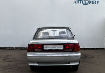 Подержанный автомобиль Suzuki Swift Sedan 2002 года (6 фото)