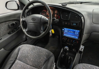 Подержанный автомобиль Kia Spectra Sedan 2007 года (10 фото)