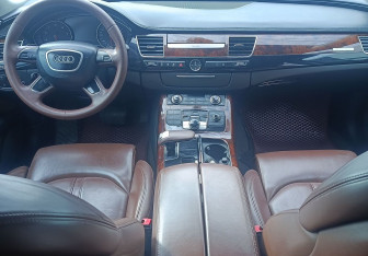 Подержанный автомобиль Audi A8 2014 года (10 фото)