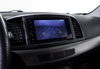 Подержанный автомобиль Mitsubishi Lancer Sedan 2013 года (14 фото)