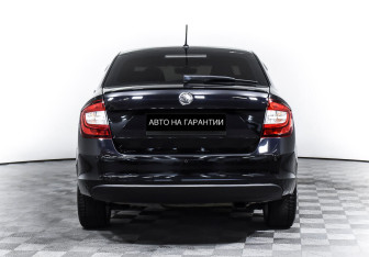Подержанный автомобиль Skoda Rapid Liftback 2015 года (4 фото)