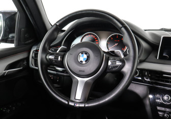 Подержанный автомобиль BMW X6 2016 года (12 фото)