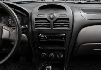 Подержанный автомобиль Nissan Almera Classic 2011 года (15 фото)