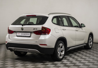 Подержанный автомобиль BMW X1 2014 года (5 фото)