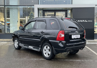 Подержанный автомобиль Kia Sportage 2009 года (7 фото)