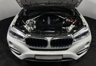 Подержанный автомобиль BMW X6 2015 года (10 фото)