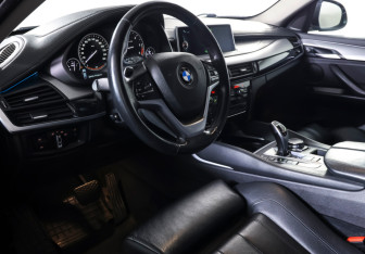 Подержанный автомобиль BMW X6 2015 года (14 фото)