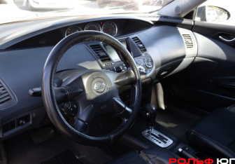 Подержанный автомобиль Nissan Primera Sedan 2003 года (10 фото)