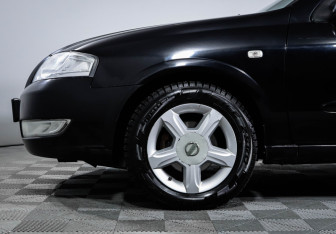 Подержанный автомобиль Nissan Almera Classic 2009 года (14 фото)
