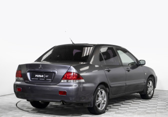 Подержанный автомобиль Mitsubishi Lancer Sedan 2009 года (5 фото)