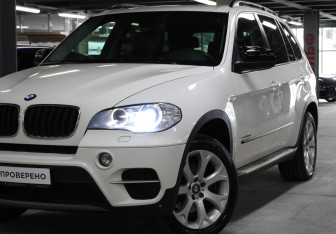 Подержанный автомобиль BMW X5 2010 года (22 фото)