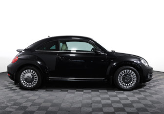 Подержанный автомобиль Volkswagen Beetle Hatchback 2014 года (4 фото)
