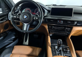 Подержанный автомобиль BMW X6 2016 года (15 фото)
