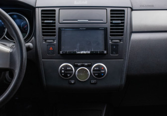 Подержанный автомобиль Nissan Tiida Sedan 2012 года (14 фото)