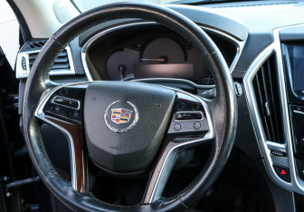 Подержанный автомобиль Cadillac SRX 2014 года (16 фото)