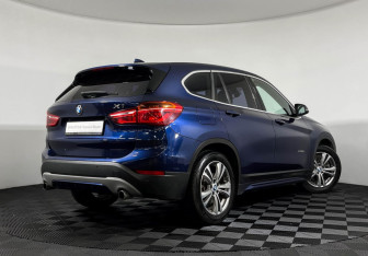 Подержанный автомобиль BMW X1 2015 года (2 фото)